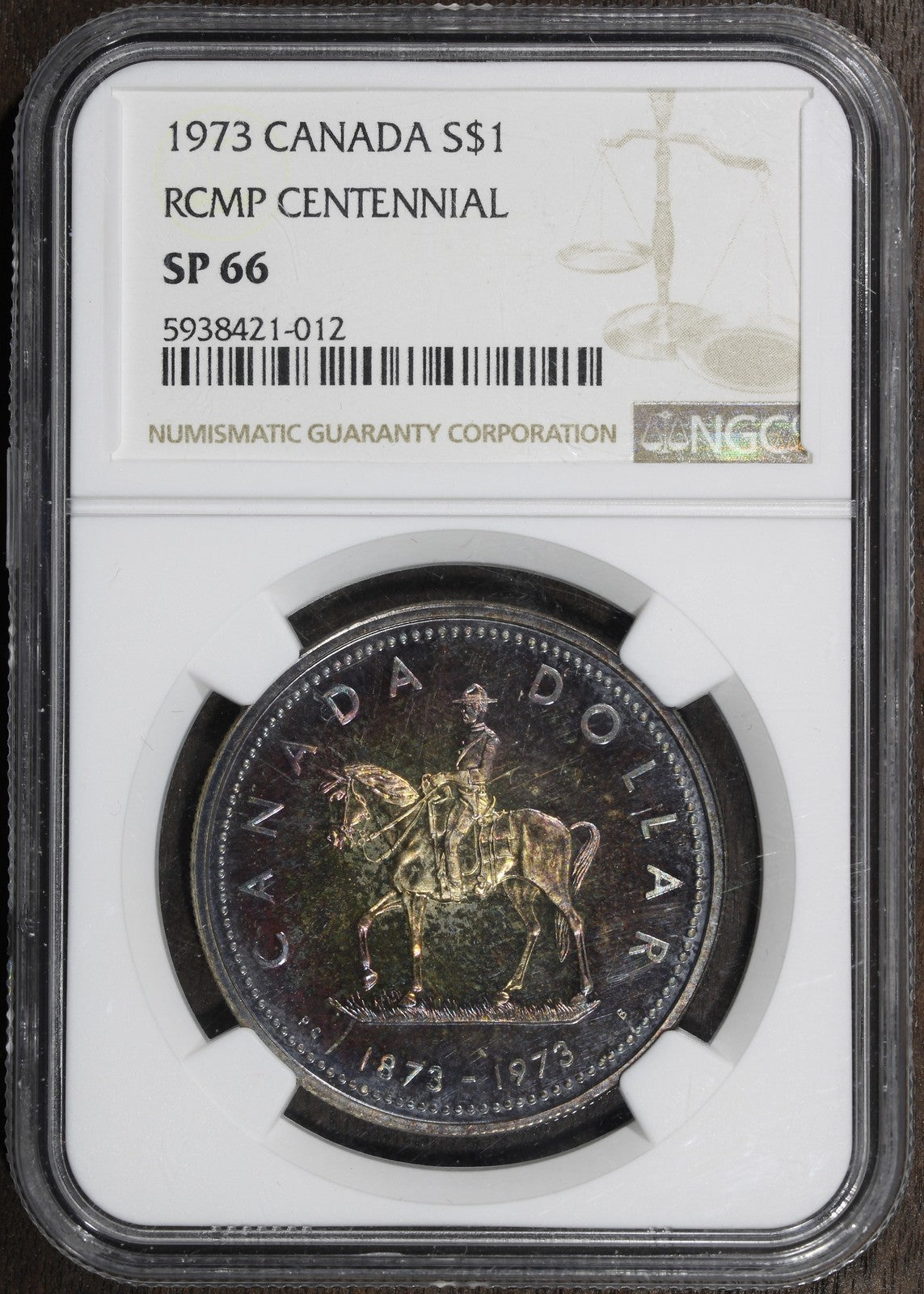 1973 (SP66) RCMP Centennial Canada Silver Dollar $1 NGC - Rainbow Toned