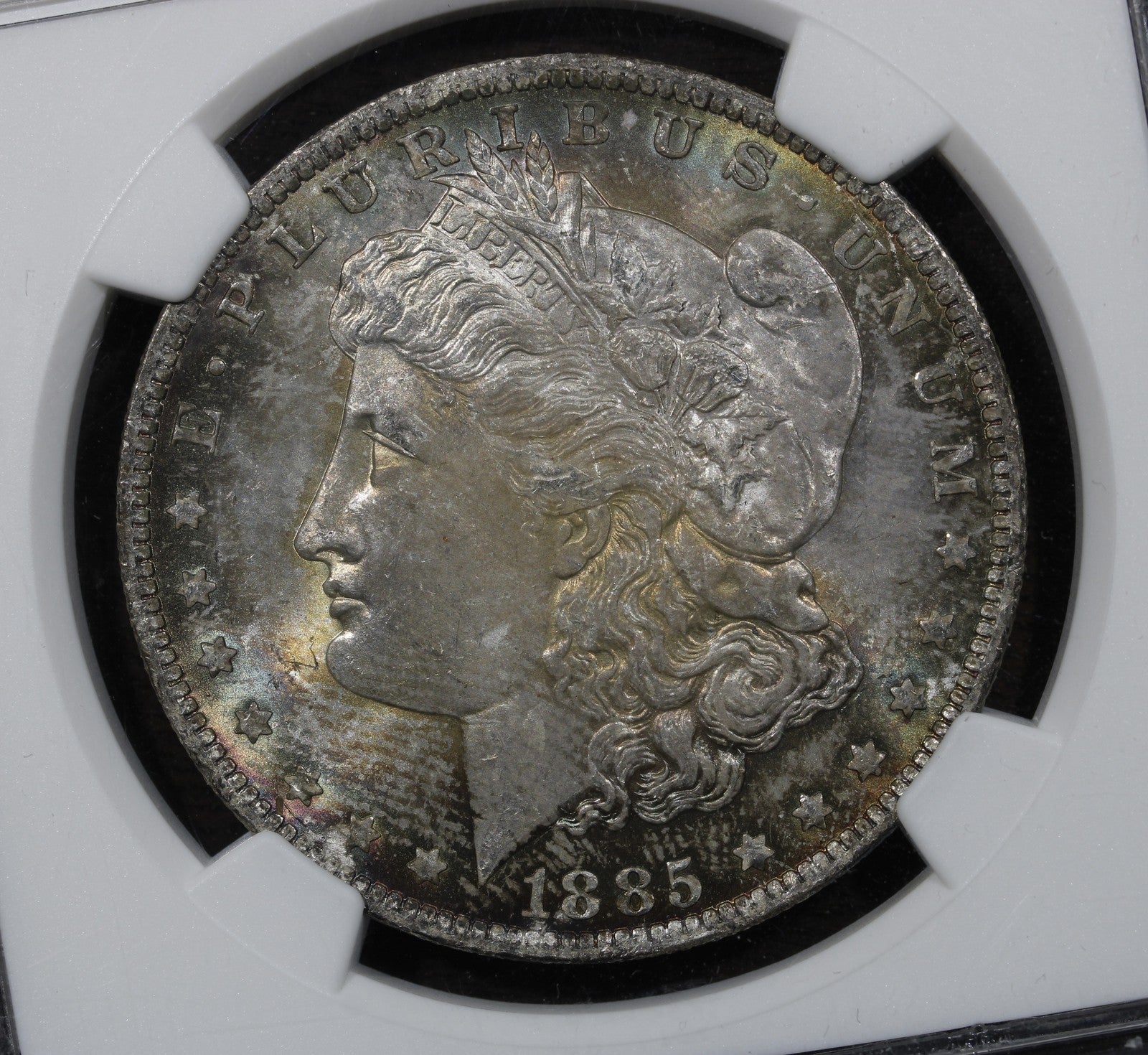 1885-O (MS65+) Morgan Silver Dollar $1 NGC - Plus Grade, Rainbow Toned