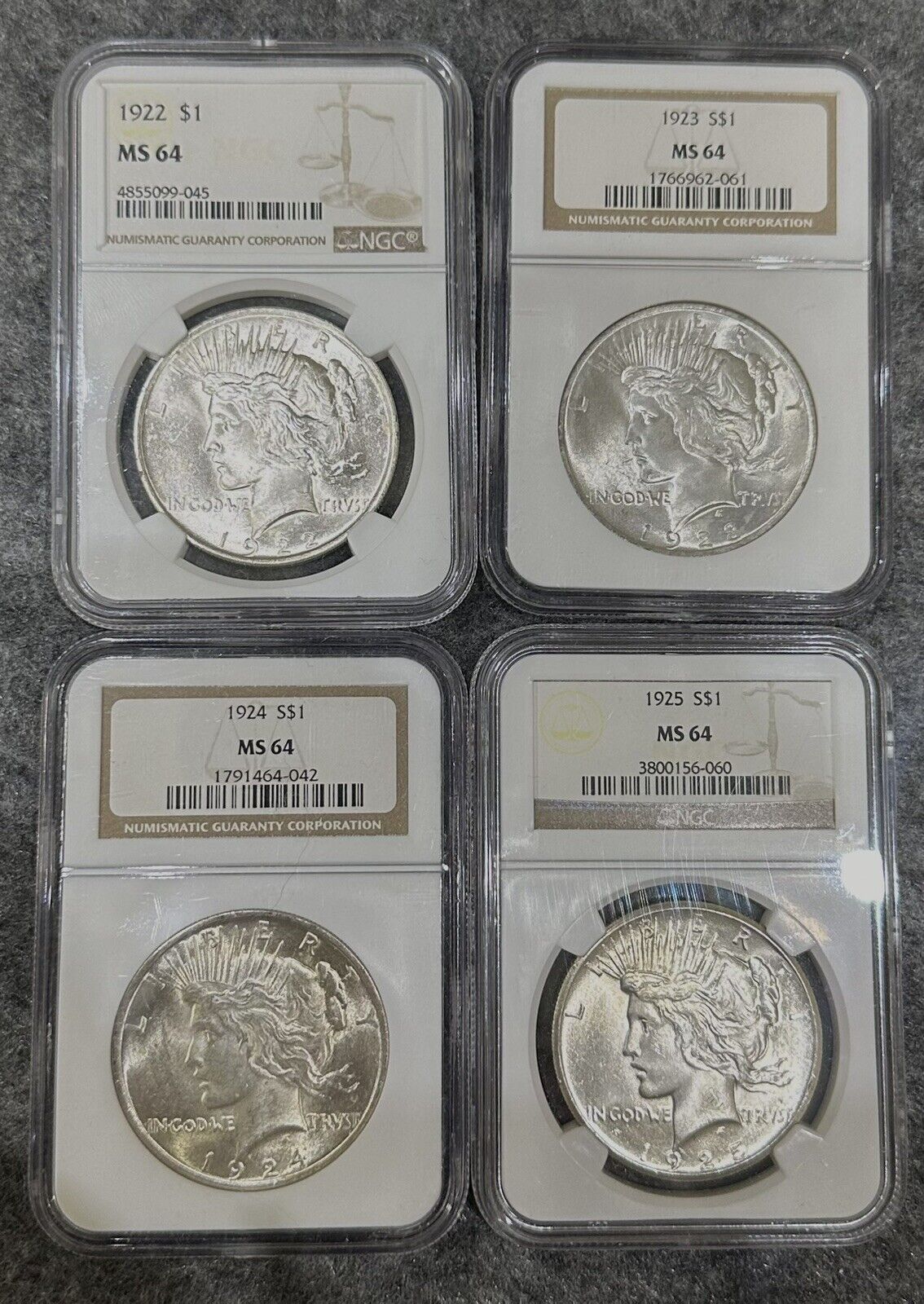 Lot of 4 Peace Silver Dollars $1 1922-P, 1923, 1924, 1925 MS64 NGC Philadelphia