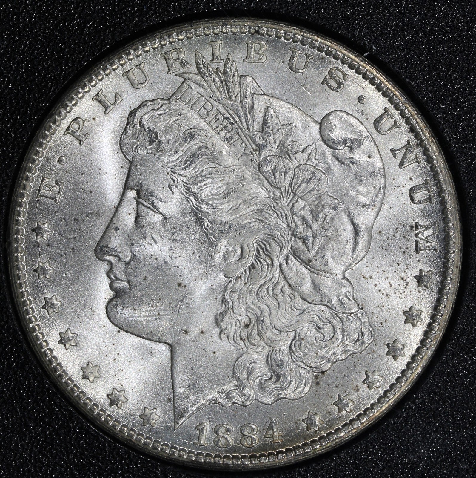 1884-CC (MS65) GSA Morgan Silver Dollar $1 NGC - RAINBOW REVERSE Chipped Holder